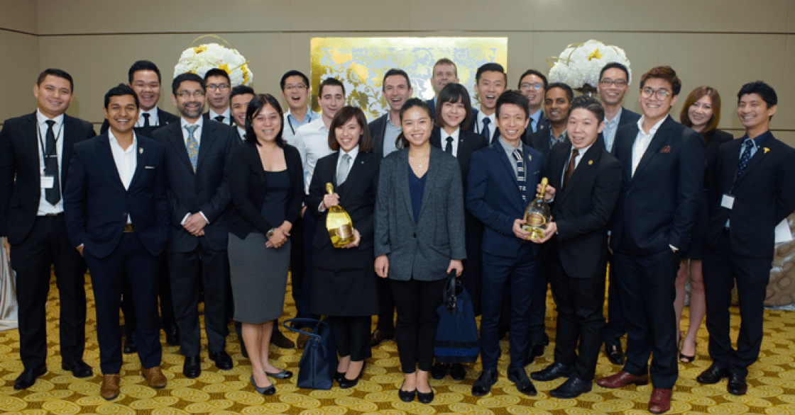A group photo of the judges and 18 participating sommeliers.