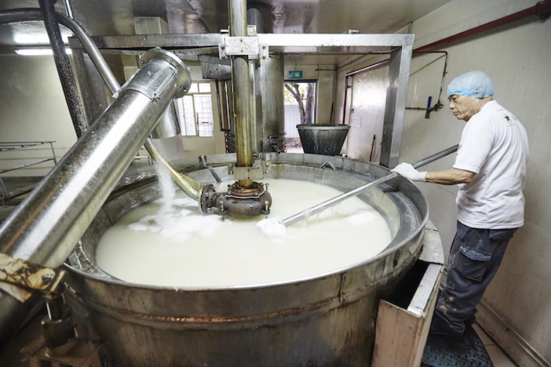 Sugar master Guo Mao Qiang hand stirs up to 10 giant vats of syrup a day