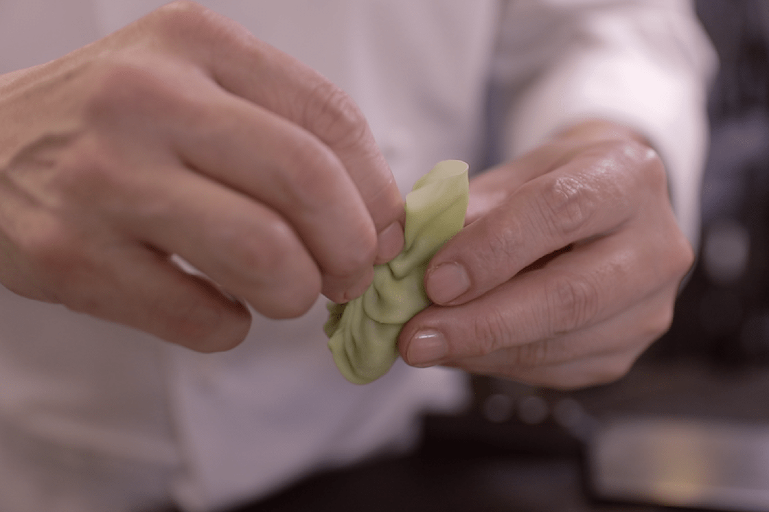 Chef Leong compares folding a dumpling to stitching a piece of cloth.