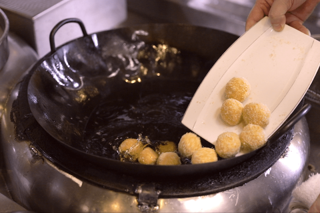 The crab pearls are deep-fried until they turn golden brown.