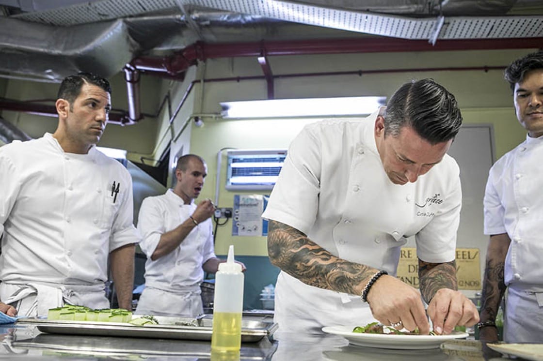 Chef Curtis Duffy plates up his dish