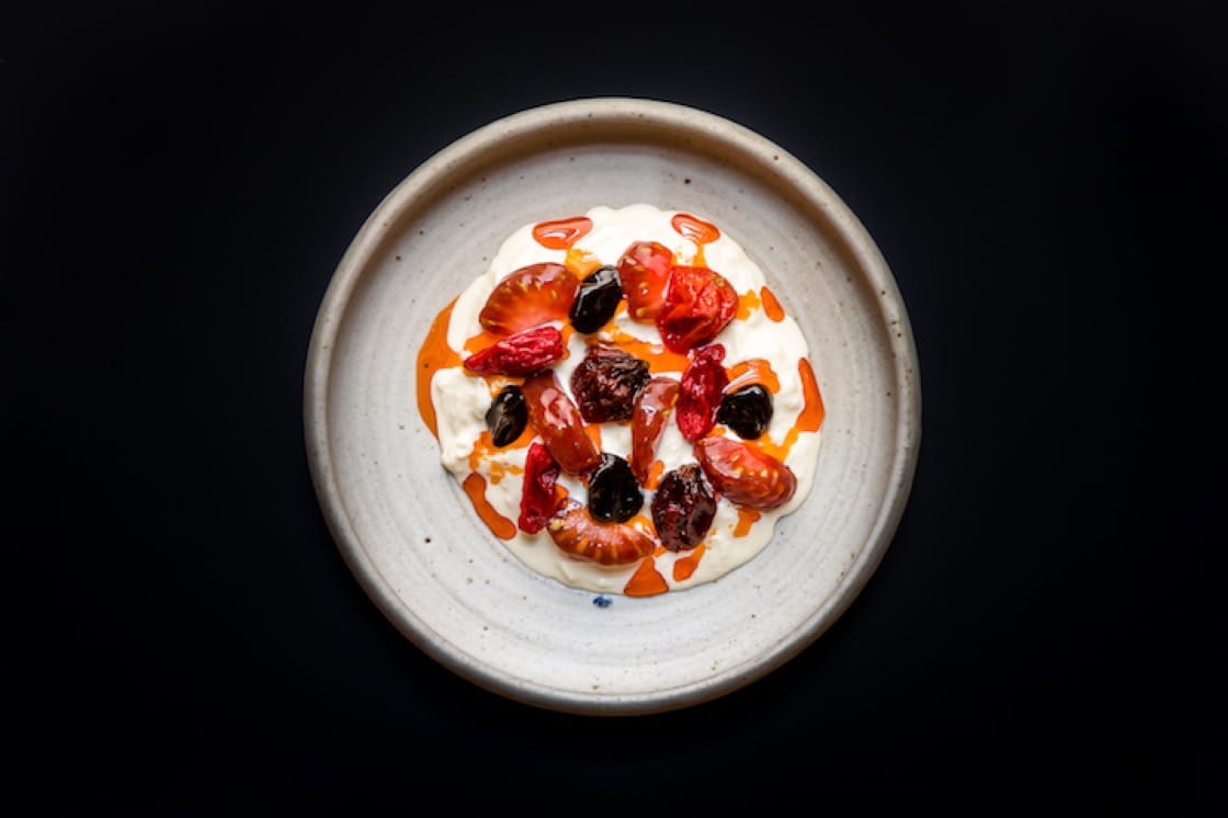Stracciatella cheese, tomato, kombu and shellfish oil.