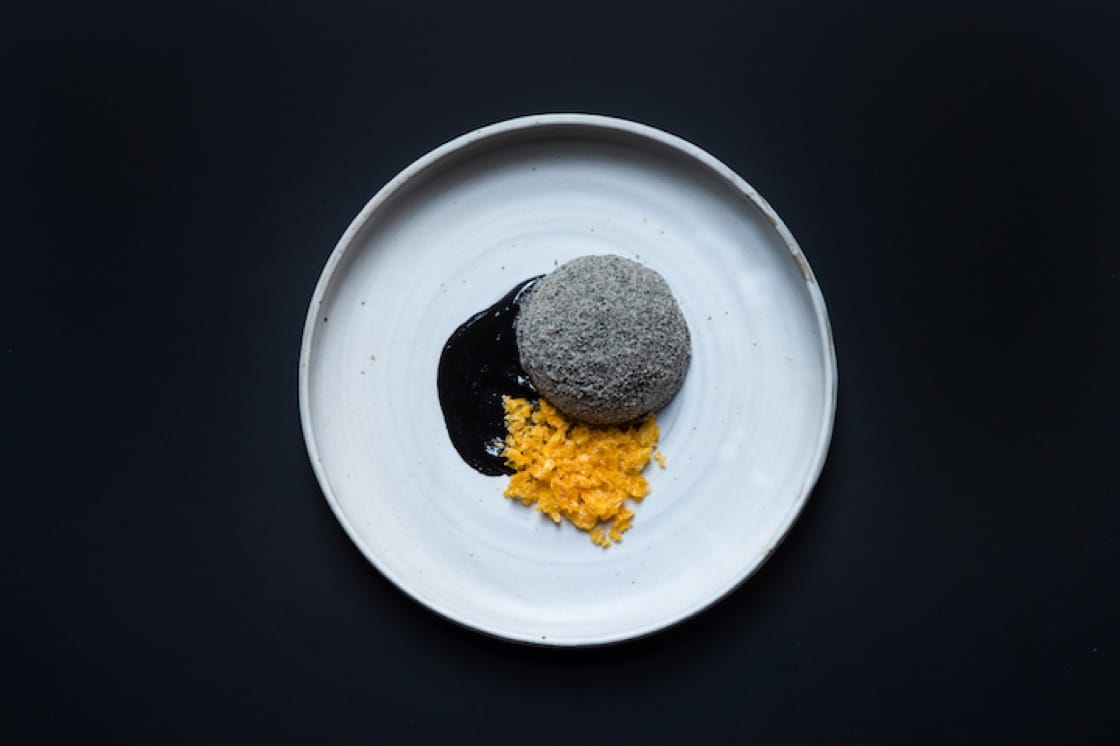 Roasted grain parfait, calamansi curd and black sesame with dried mandarin.