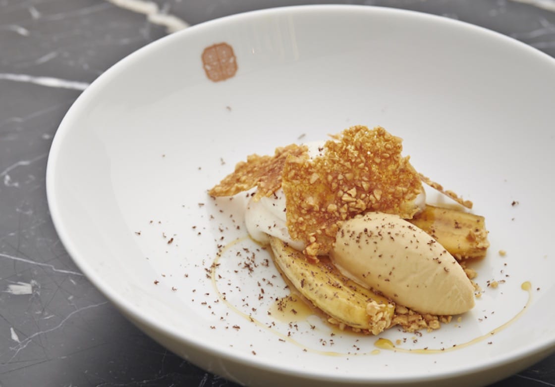 Caramelised bananas, banana milk, peanut brittle, toffee ice-cream