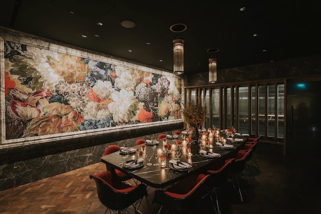 A boardroom by day transforms into an elegant private dining room