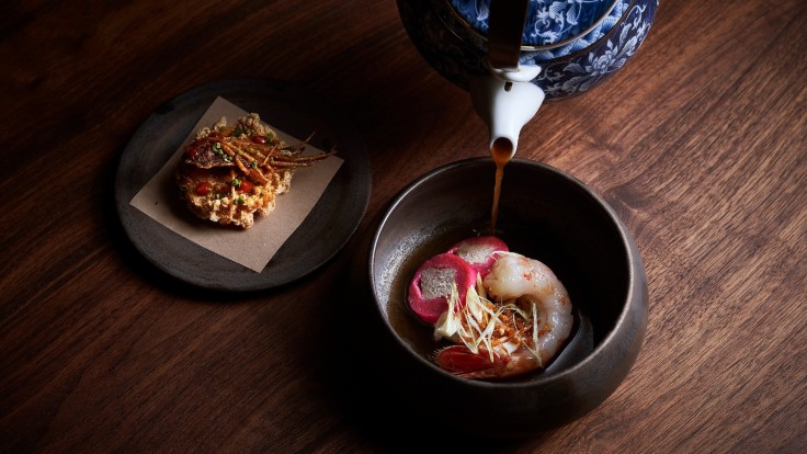To minimise food wastage, leftover prawn flesh and shells are used to make soup stock and garum, and prawn legs are dehydrated as seasoning in Labyrinth's Prawn Noodle Soup, while the pink sausages are made from excess beetroot pulp and juice