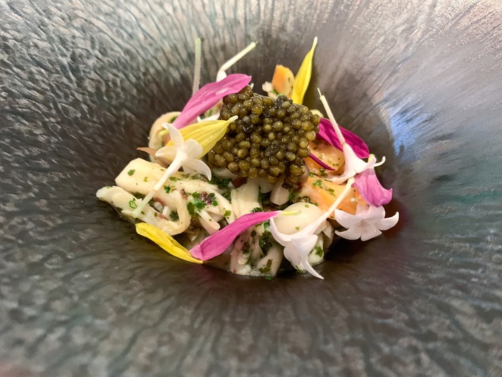 Clams - Baby Potato - Osciètre Caviar - Flowers at Plaisance by Mauro Colagreco. (©MICHELIN)